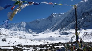 Mountains and prayer flags in Tilicho Lake, Annapurna, Nepal