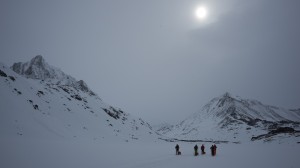 Skiing with a pulk, cloudy day, Greenland